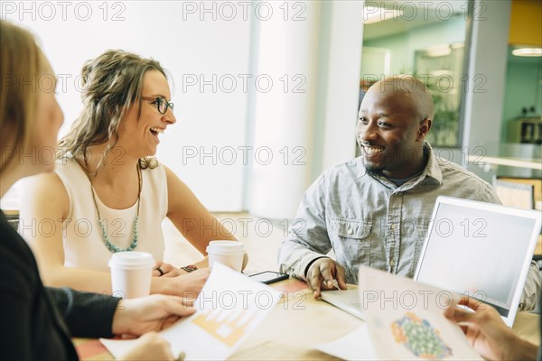 Business people working together in cafe