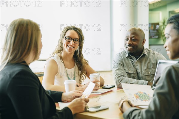 Business people working together in cafe