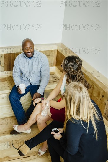 Business people talking in office lobby