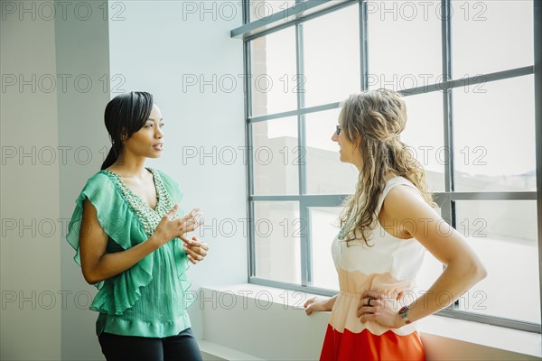 Businesswomen talking in office