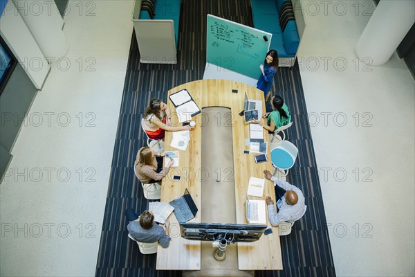 High angle view of business people working in office meeting