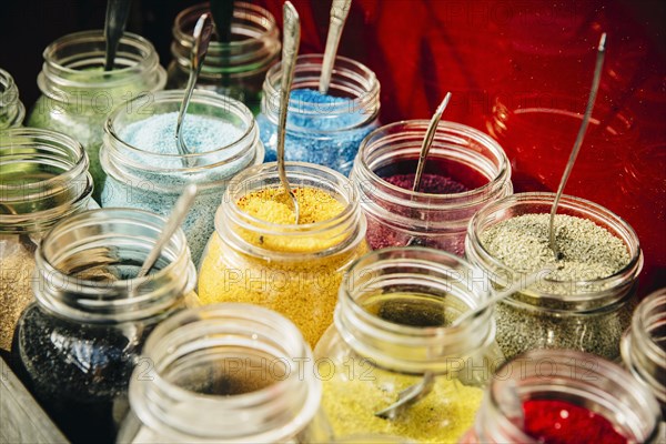 Close up of jars of pigment powder