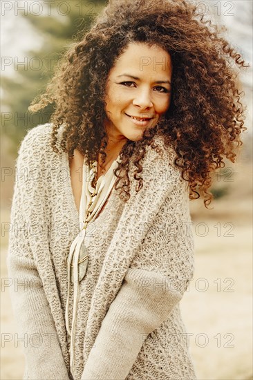 Mixed race woman wearing stylish sweater