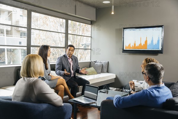 Business people having meeting in office lounge