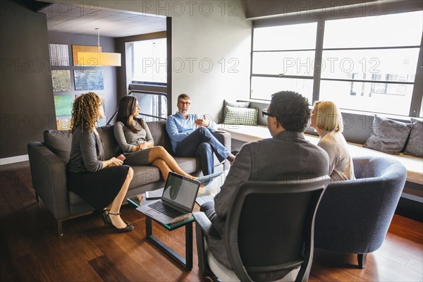 Business people talking in office meeting