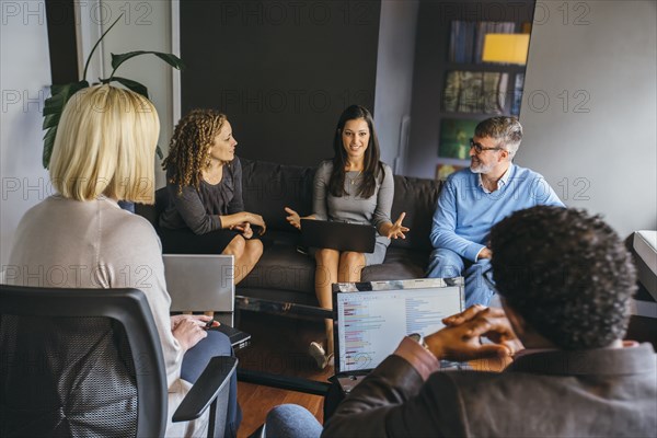 Business people talking in office meeting