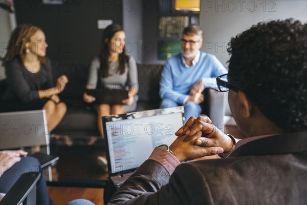 Business people talking in office meeting