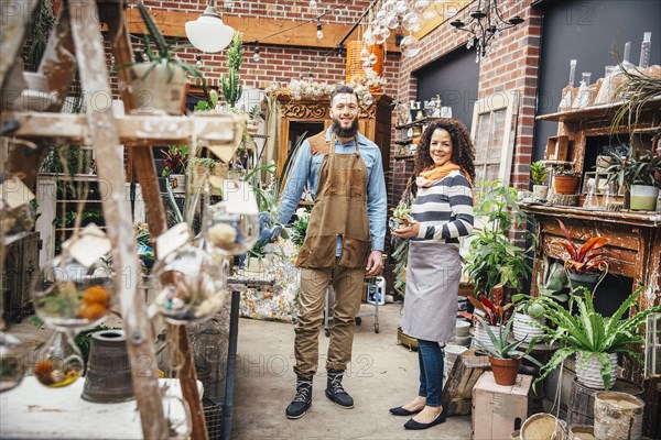 Employees smiling in plant nursery