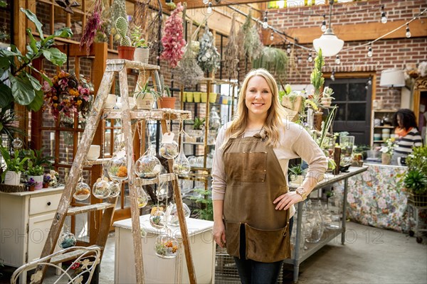 Employee smiling in plant nursery