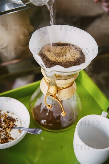 Caucasian man pouring breakfast coffee