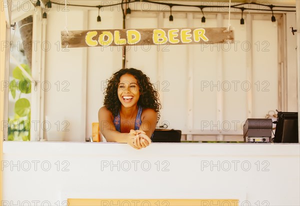 Woman leaning in beach shack