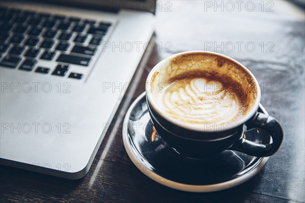 Close up of cup of coffee with latte art