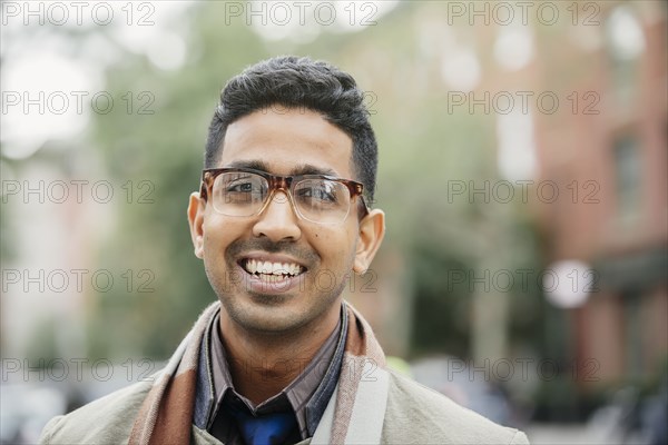 Indian man smiling in city