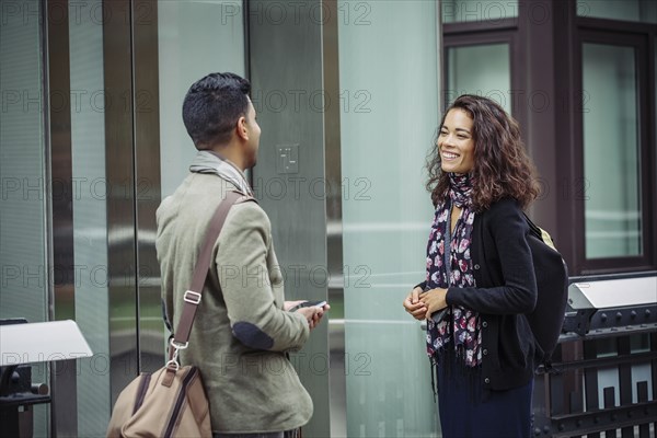 Couple talking in city