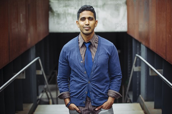 Indian businessman standing on office steps