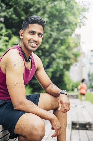 Indian athlete resting in city