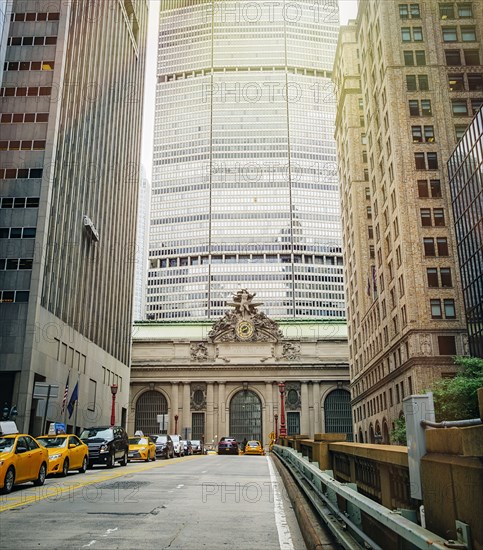 High rise buildings and taxi cabs on city street