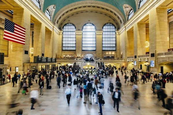 Blurred view of people in train station