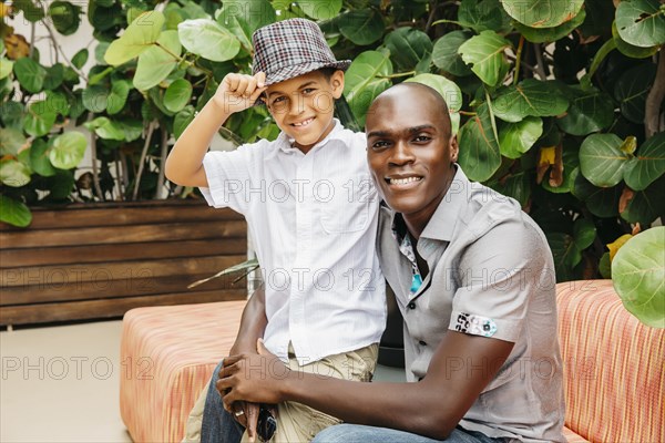 Father and son hugging in backyard