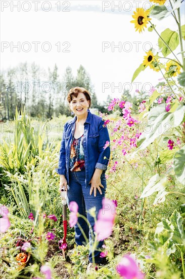 Caucasian woman smiling in garden