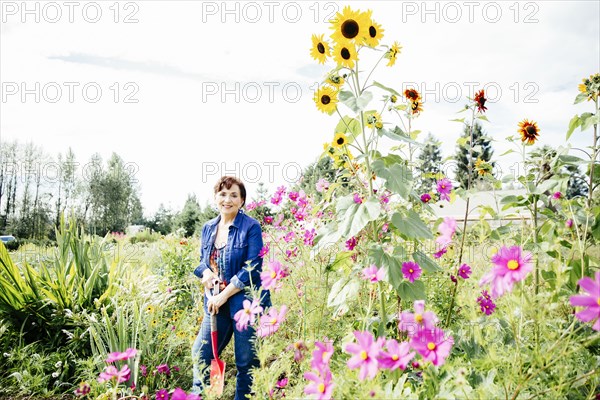 Caucasian woman smiling in garden