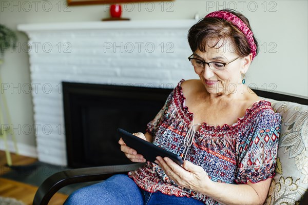 Caucasian woman using digital tablet