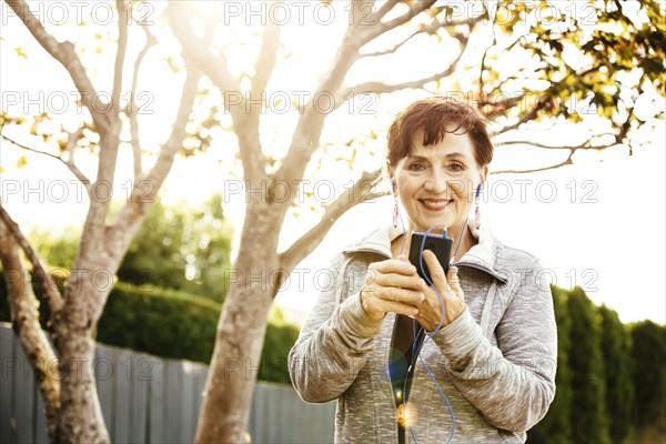 Caucasian woman using cell phone outdoors