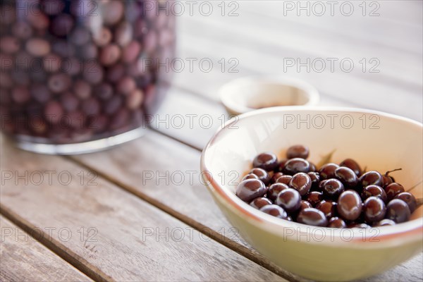 Bowl of olives on table