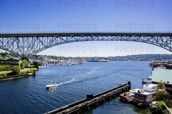 Blue sky and bridge over urban marina