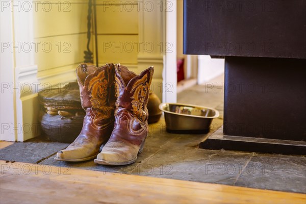 Dirty boots on stone tile