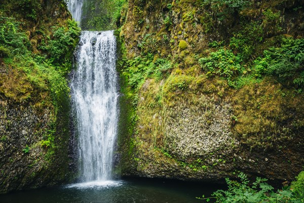 Multnomah Falls over rocky hillside