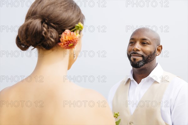 Bride and groom standing outdoors