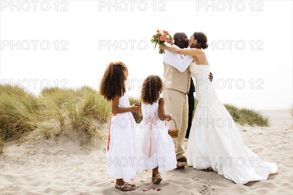 Bride and groom kissing in outdoor wedding