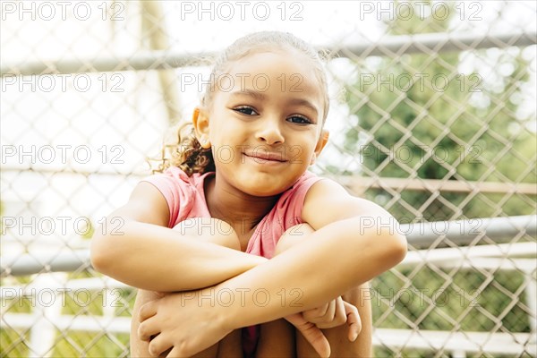 Mixed race girl smiling outdoors