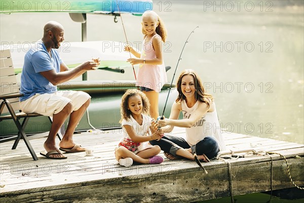 Family fishing in lake