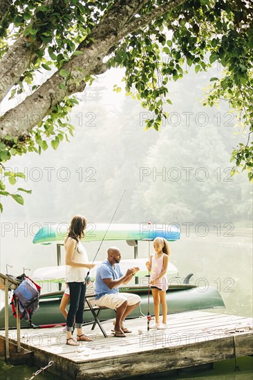Family fishing in lake