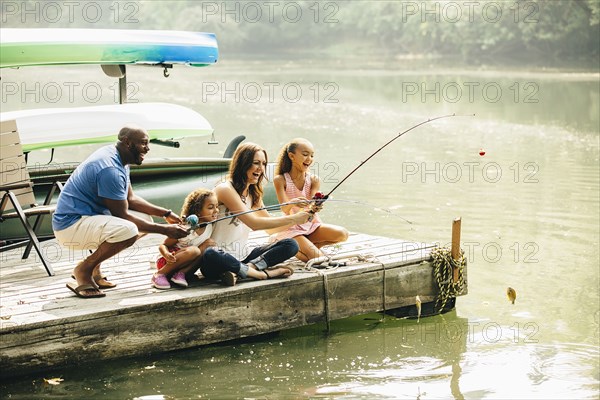 Family fishing in lake