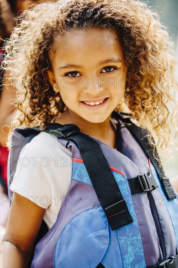 Mixed race girl smiling outdoors