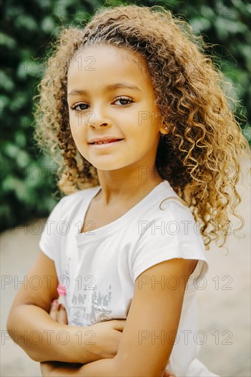 Mixed race girl smiling outdoors