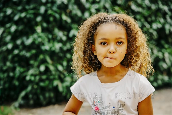 Mixed race girl standing outdoors