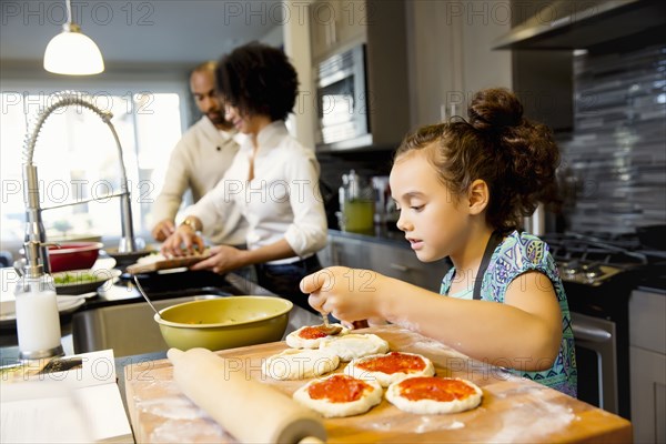 Family cooking in kitchen