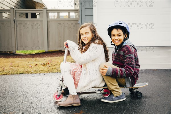 Mixed race children playing outdoors