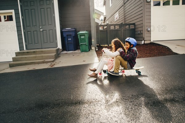 Mixed race children playing outdoors