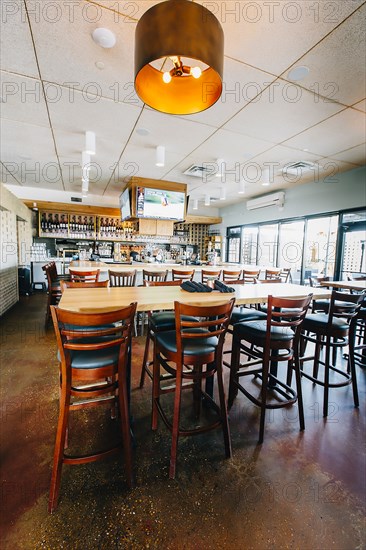 Empty chairs and tables in cafe