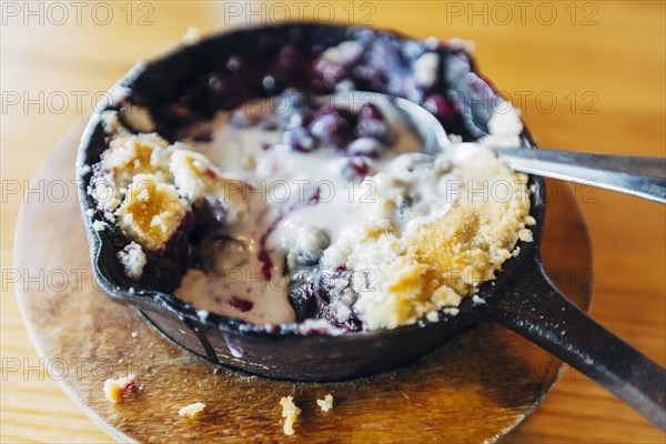 Skillet dessert with melted ice cream