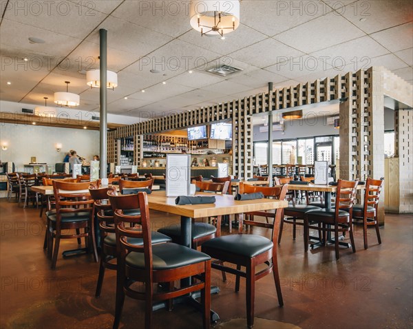Empty tables and chairs in restaurant
