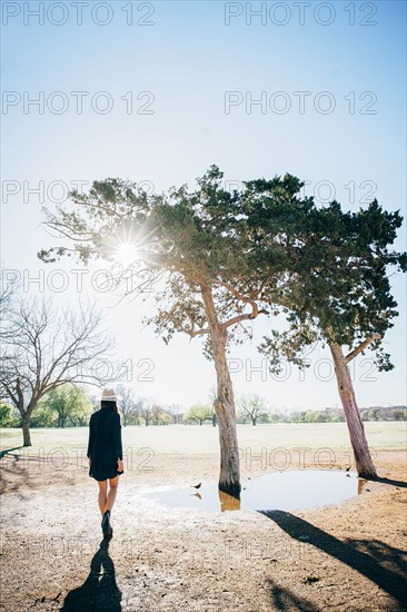 Chinese woman walking in field