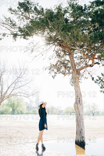 Chinese woman walking in field