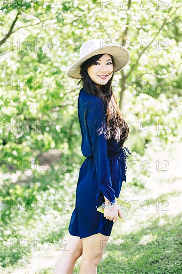 Chinese woman standing in garden