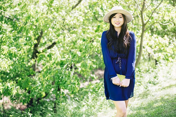 Chinese woman standing in garden